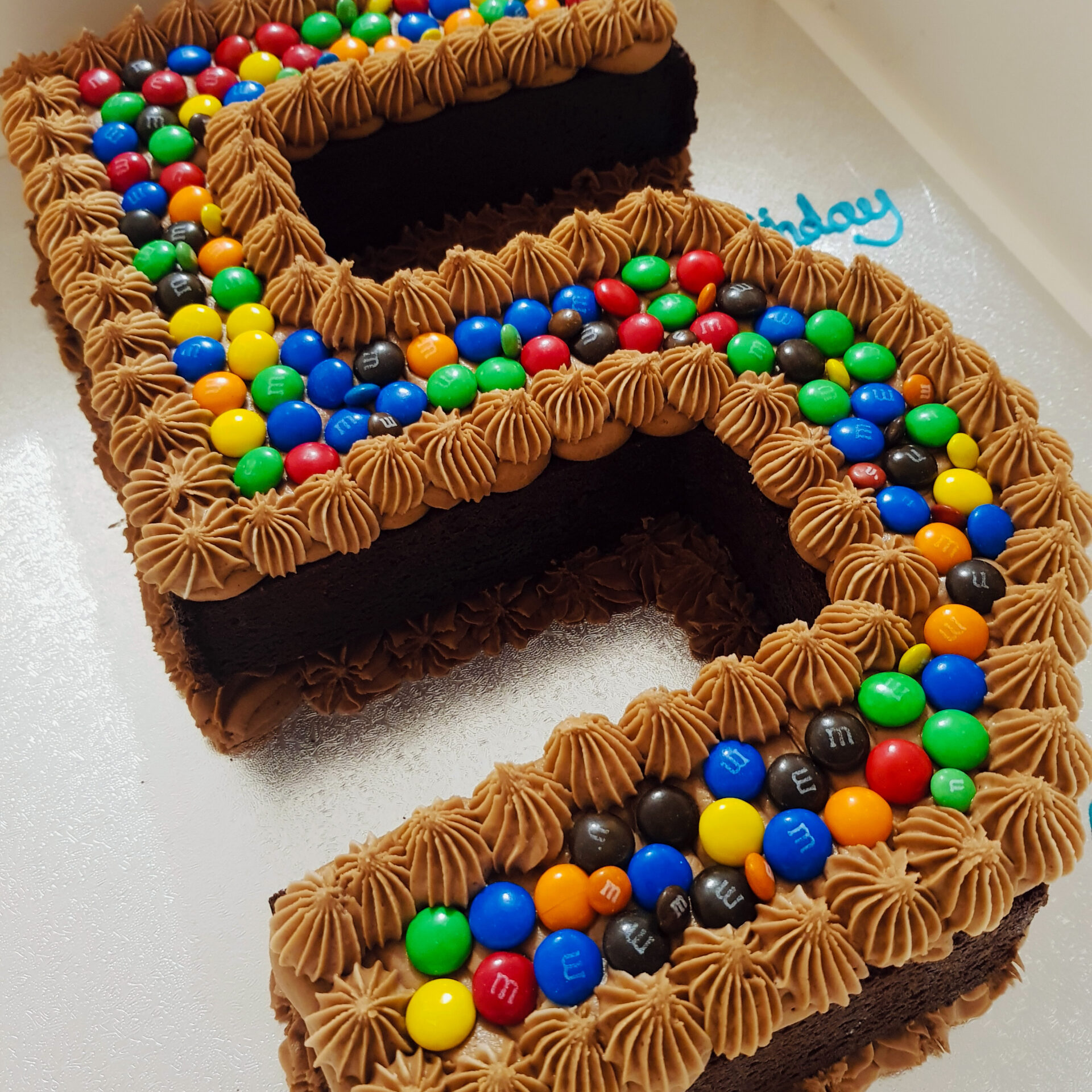 Buckets of M&M's Kit Kat Birthday Cake Recipe - Mom Loves Baking